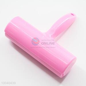 Pink <em>lint</em> roller/dust remover