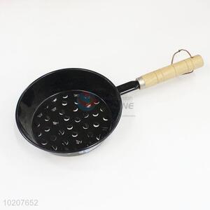Black iron grill pan with holes