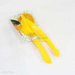 Plastic yellow lemon squeezer and orange juicer