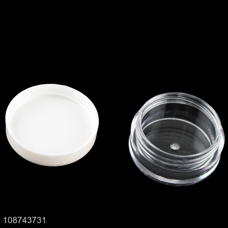 Online wholesale empty plastic cosmetic cream jars set with a spoon