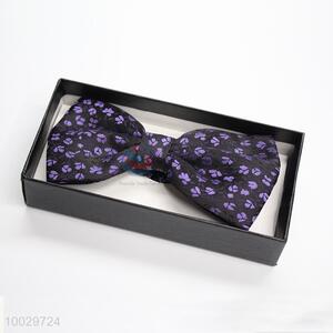 Black bow tie with purple flower pattern