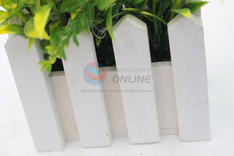 Comfortable artificial flower miniascape with wooden flowerpot for decoration