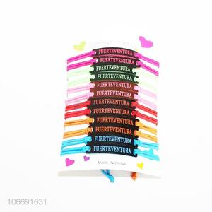 Promotional 12pcs colorful elastic cord bracelet with charms