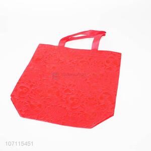Low price premium red folding non-woven shopping bag
