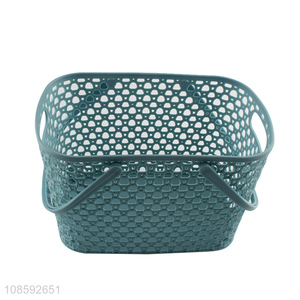 Wholesale hollowed-out plastic storage basket with handles for bathroom